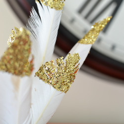 Making these Glitter Dipped Feathers are so easy