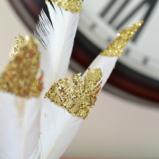 Making these Glitter Dipped Feathers are so easy