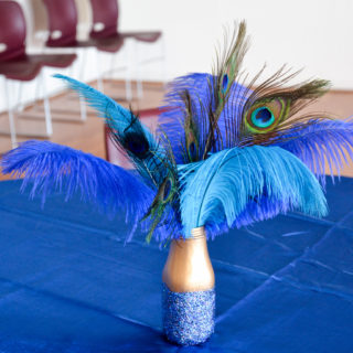 DIY glitter jar peacock feather arrangement from an old bottle