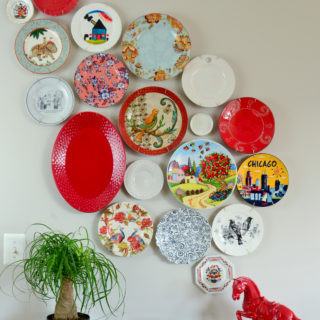 Mismatched plates from the thrift store and clearance aisle come together to create this beautiful asymmetrical plate wall